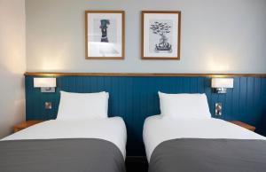 Tempat tidur dalam kamar di The Bay Horse Hotel