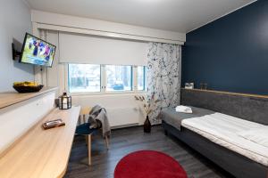 Ein Bett oder Betten in einem Zimmer der Unterkunft Hotel Linnasmäki