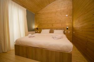 Postel nebo postele na pokoji v ubytování Mestia Villas