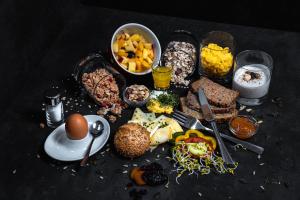 a table with a bunch of food on it at B&B Hotel Die Barbara in Schladming