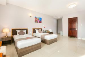 Giường trong phòng chung tại Căn hộ hướng biển - khách sạn San Hô Vũng Tàu