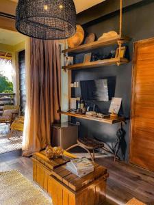 a room with a table and a shelf with baskets at El Nido Boutique Vacation Villas in El Nido
