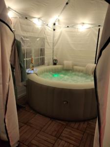 a large bath tub in a room with at B&B LA MARMOTTA in Coazze