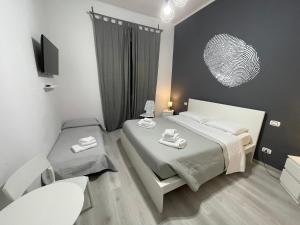 A bed or beds in a room at Sensation House