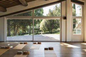 an open room with a large glass door at Bioagriturismo il cerreto in Pomarance