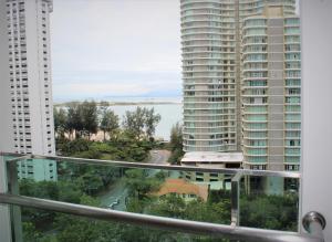 a view of the water from the balcony of a building at Mansion One SeaView Georgetown 2BR 6 Pax in George Town