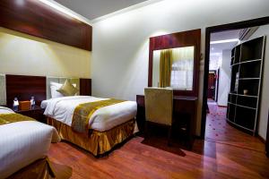 Postel nebo postele na pokoji v ubytování Meral Oasis Resort Taif
