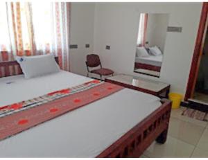 Katil atau katil-katil dalam bilik di R.K.Inn Guest House, Nonankuppam