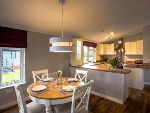 a kitchen and dining room with a table and chairs at Beech - Ukc4530 in Darsham