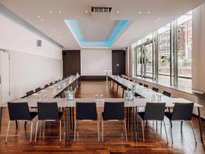 a large conference room with tables and chairs at Mercure Hotel Hamburg City in Hamburg