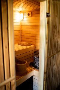 a small wooden sauna with a bed in it at L ABRI spa et détente in Liergues