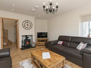 a living room with a couch and a coffee table at Springbank in Eyre