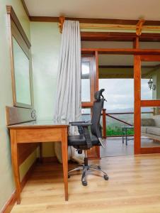 a office with a desk and a chair and a window at CAPELLA RESORT (ELEMENTAITA, KENYA) in Nakuru