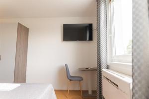 TV a/nebo společenská místnost v ubytování Hotel Triester