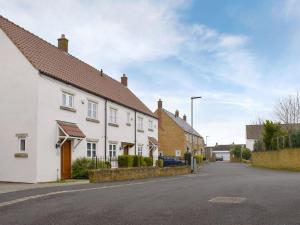 a row of white houses on a street at Hollies Cottage 9 - Ukc4532 in Martock
