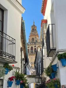 a view of a building from between two buildings at Apartamento El Rincón de la Verdad in Córdoba