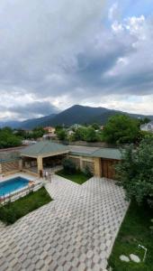 an aerial view of a house with a swimming pool at Raffles Villa with pool in Gabala