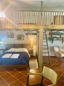 a bedroom with a bunk bed and a staircase at Casa Girassol with a beautiful private Pool and Garden in Sintra +28 photos
