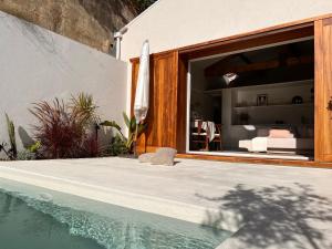 a house with a swimming pool next to a bedroom at CASA DOS OLIVAIS in Porto