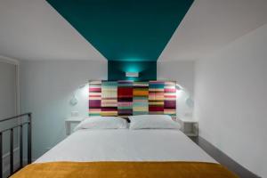 A bed or beds in a room at Casa Trastè
