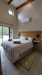 A bed or beds in a room at Hyena Den - Marloth Park