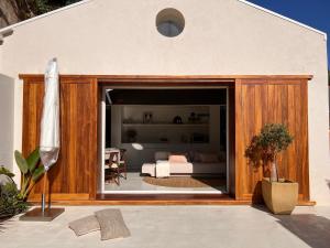 a living room with a large sliding glass door at CASA DOS OLIVAIS in Porto