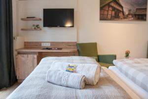 Voodi või voodid majutusasutuse Hotel Am Deich toas