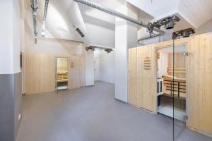 a room with wooden lockers in a building at Ferienapartments am Krusespeicher Ferienapartments am Krusespeicher 2-17 in Wismar