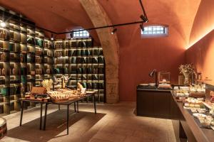 a store with a lot of shelves of wine bottles at Casa da Companhia Hotel & Spa, Vignette Collection by IHG in Porto
