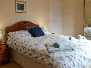a bedroom with a bed with towels on it at Mountain View in Silloth