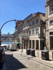 a group of buildings on a city street at Oca Ribeira do Porto AT in Porto