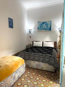 Postel nebo postele na pokoji v ubytování Riad chez brahim