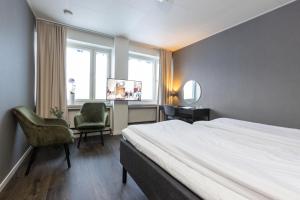 Postel nebo postele na pokoji v ubytování Hotel Victoria