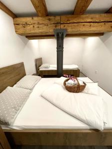 a bedroom with a bed with a basket on it at The Comfortable Loft in Ljubljana