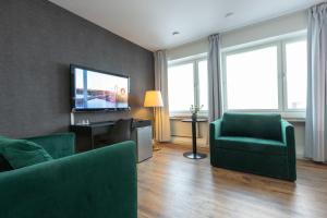 TV a/nebo společenská místnost v ubytování Hotel Victoria