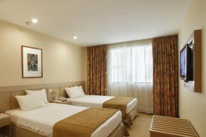 Cama ou camas em um quarto em Windsor Florida Hotel mais 20 fotos