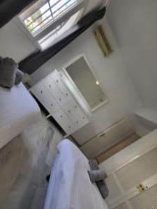 an overhead view of a bedroom with a bed and a sink at Luxury 4 bed townhouse Duquesa with breathtaking views close to Port and Beach in Manilva