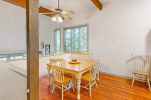 a dining room with a wooden table and chairs at Kingswood 2C Condominium in Quechee