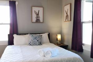 a bedroom with a bed with two towels on it at Perfect Combo of Charm & Comfort- 2Bedroom Home in Noblesville