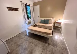 Cama ou camas em um quarto em Pousada Paloma