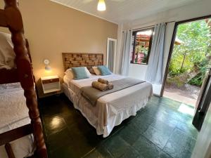 Cama ou camas em um quarto em Pousada Paloma