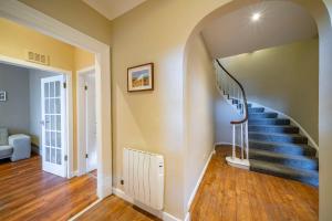 a hallway with a spiral staircase in a home at 1 Shore in Arbroath