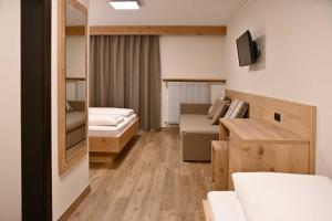 Voodi või voodid majutusasutuse Hotel Toblacherhof toas