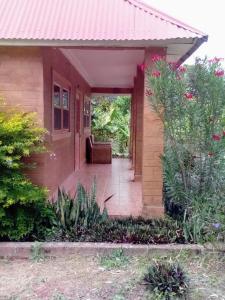 a small house with a red roof at Riverside Lodge 