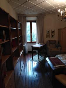 a living room with a bed and a couch and a table at Dimora Giosafatti in Ascoli Piceno +10 photos