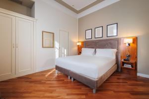 Postel nebo postele na pokoji v ubytování Hotel Embassy