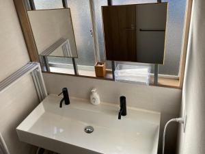 Koupelna v ubytování ゲストハウス 西村サイクル（24C）