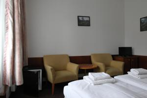 Voodi või voodid majutusasutuse Hotel Skála toas