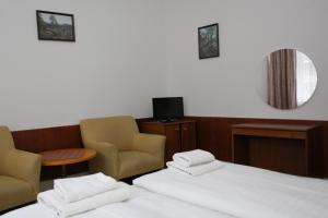 Voodi või voodid majutusasutuse Hotel Skála toas