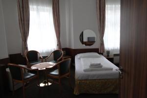 Voodi või voodid majutusasutuse Hotel Skála toas